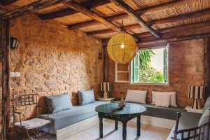 stone walls, mud bricks and wooden beams in the traditional moroccan village house khanfous retreat
